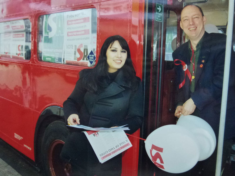 London Socialist Alliance national press officer Anna Chen with our candidate Greg Tucker, a train driver, on board the battle bus, 2000